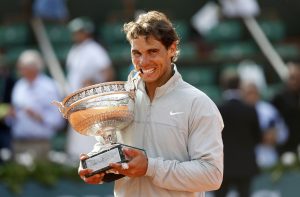 Rafael Nadal of Spain poses with one of his trophies