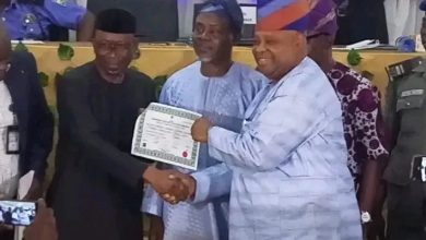 Adeleke receiving his certificate of return