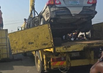 Lagos driver survives as large container falls on his vehicle