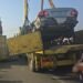 Lagos driver survives as large container falls on his vehicle