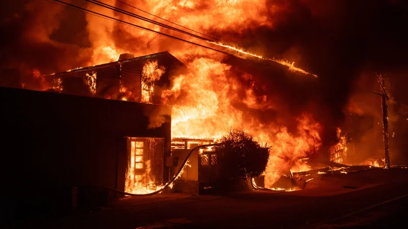 Thousands flee as wildfires burn out of control in Los Angeles
