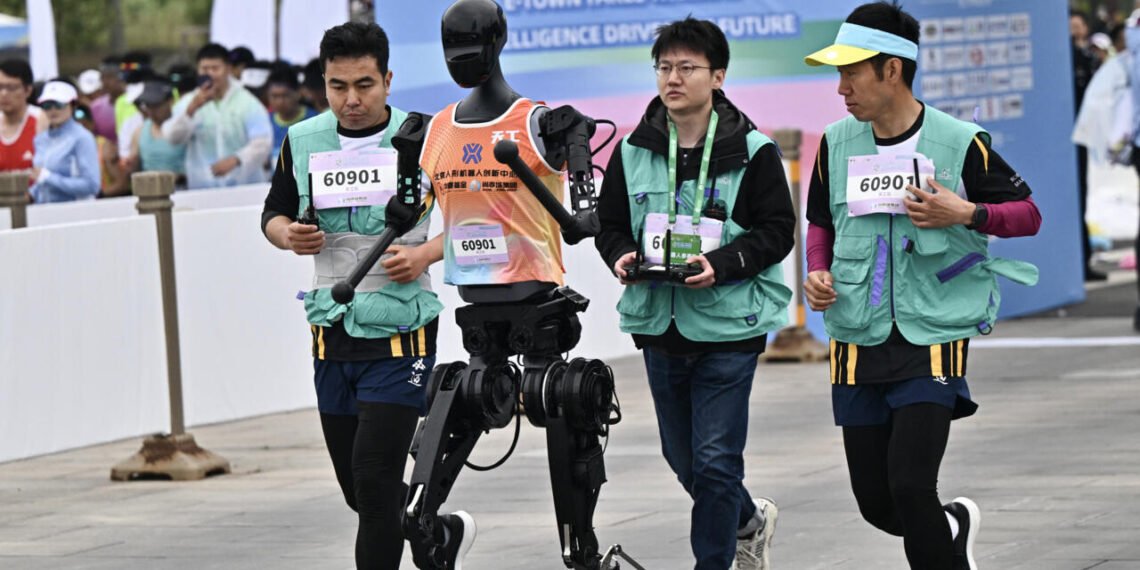 Humans defeat robot runners in Beijing's half-marathon
