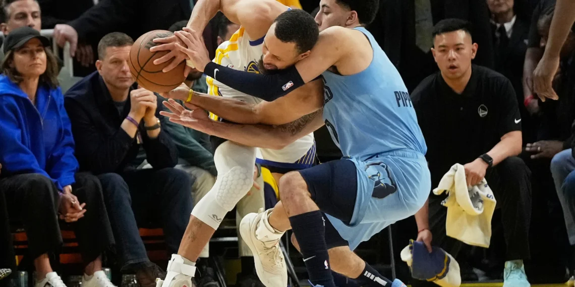 Butler, Curry lead Warriors past Grizzlies 121-116 to secure seventh seed in West playoffs