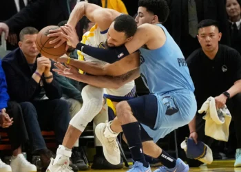 Butler, Curry lead Warriors past Grizzlies 121-116 to secure seventh seed in West playoffs