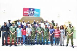 A delegation of Defence Correspondents in a group photograph with the Theatre Commander of Operation Fansan Yamma (OPFY), Major General Oluyinka Soyele and other Principal and Senior Officers.