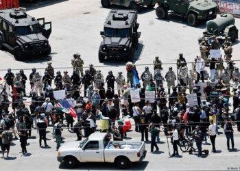 LA police enforce curfew as Trump vows to 'liberate' city