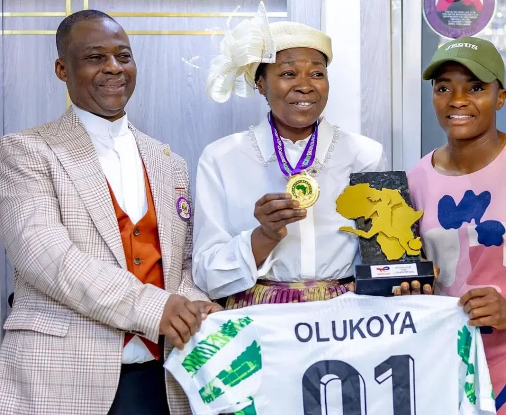 Super Falcons star Rasheedat Ajibade pays tribute to Pastor Olukoya as she presents WAFCON medal