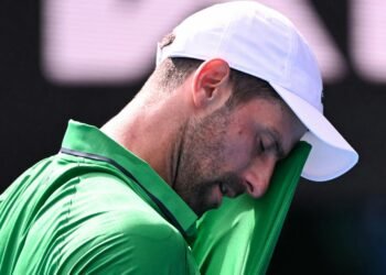 Djokovic scrapes into Australian Open semis after Musetti injury