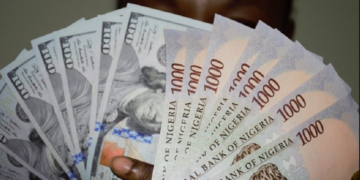Naira holds steady against dollar at official, parallel markets