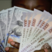 Naira holds steady against dollar at official, parallel markets