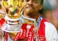Nwankwo Kanu celebrates Arsenal F.C. Premier League triumph