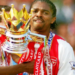 Nwankwo Kanu celebrates Arsenal F.C. Premier League triumph