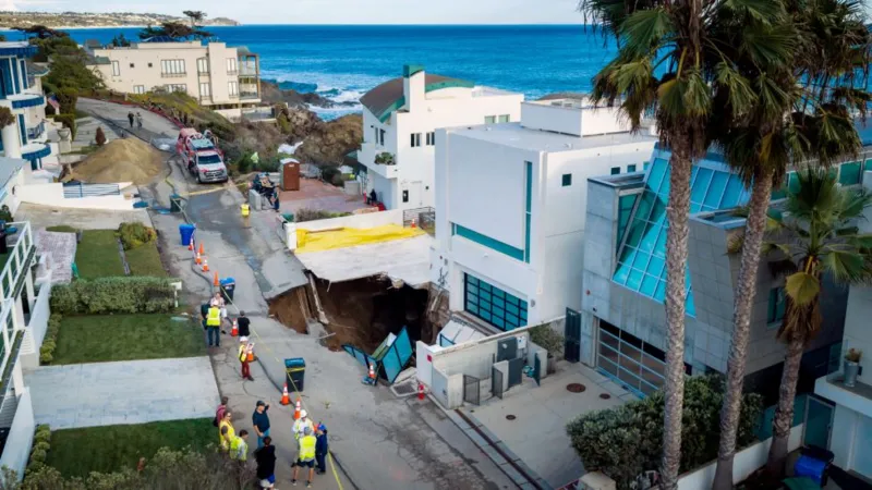 A large sinkhole has opened up outside a house in Malibu reportedly belonging to Hollywood actor Nicolas Cage.