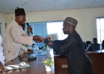 Handshake during Adamawa State Polytechnic leadership transition