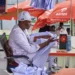 Abdulkadir Basari at his sewing machine during the 120-hour sewing marathon in Kano