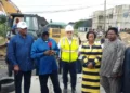 Gov. Sheriff Oborevwori speaking beside a Julius Berger representative at the failed section of the East-West Road in Agbarho
